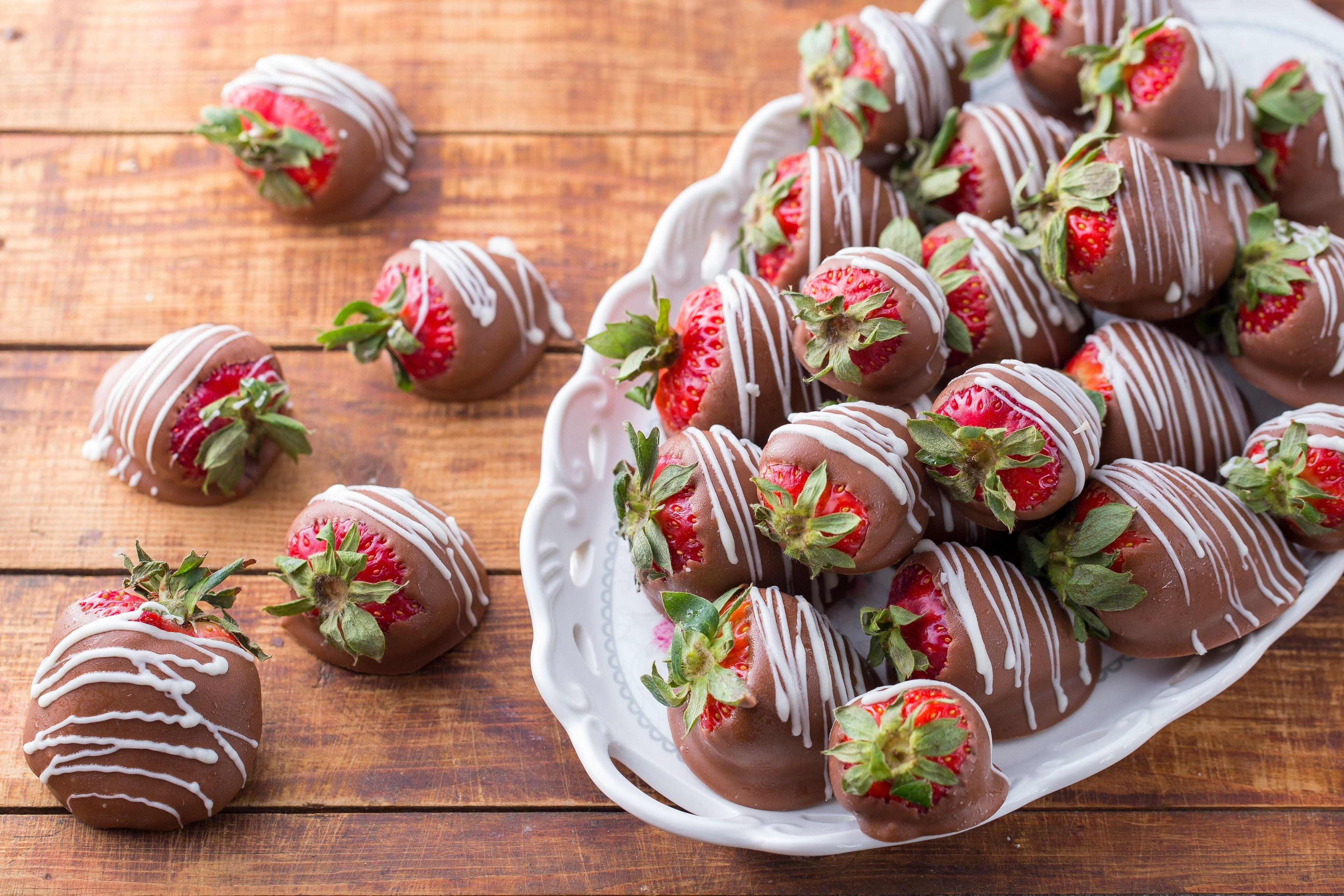 bowl of strawberry covered with chocolates